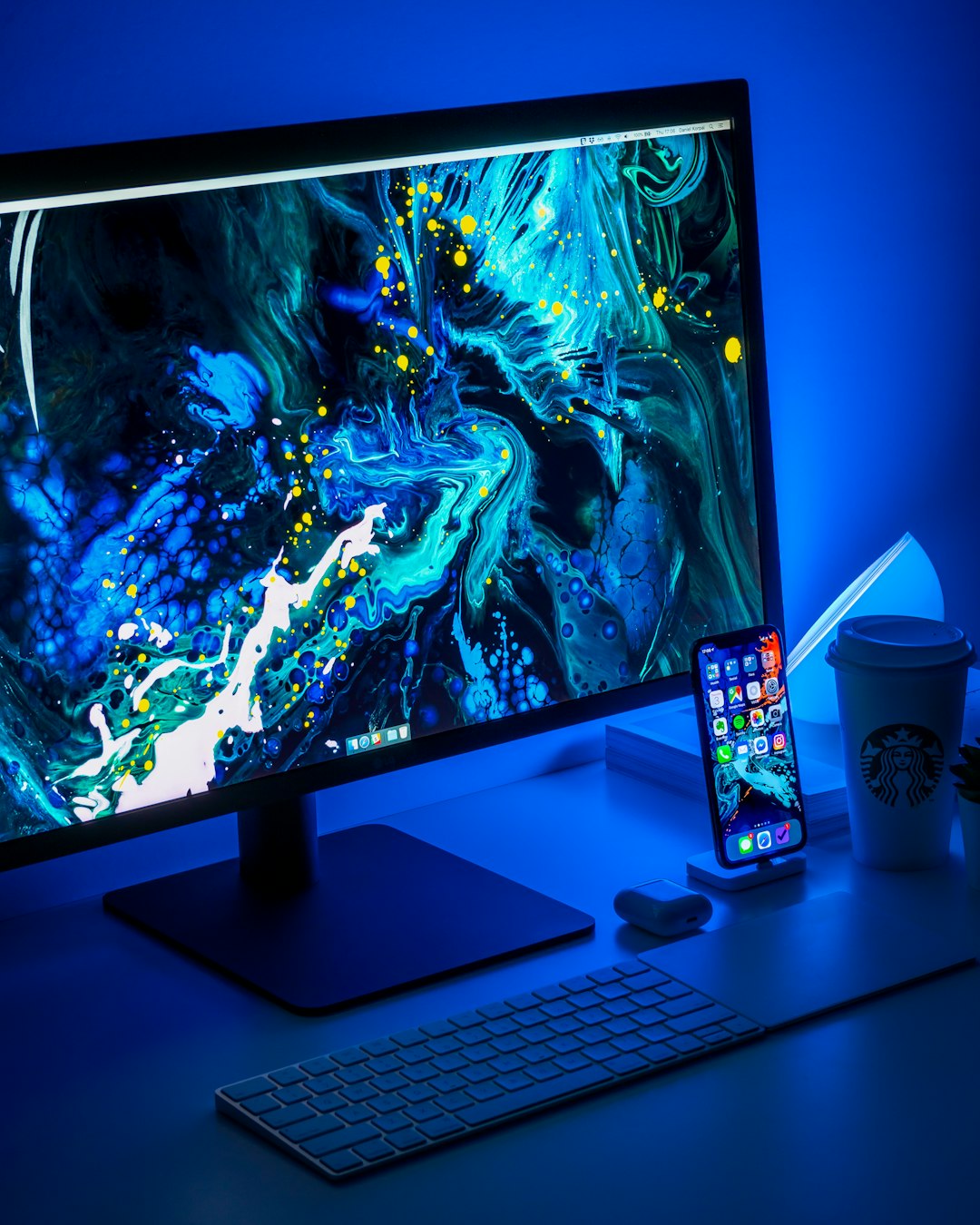 Flat screen computer monitor beside keyboard