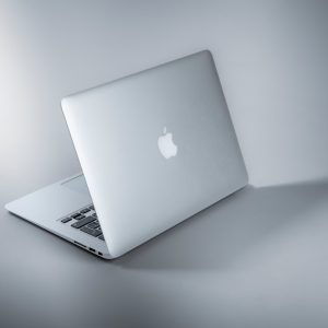 Silver laptop on white table