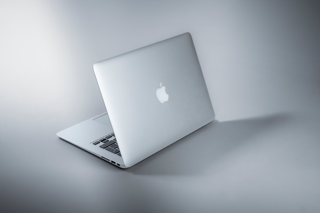 Silver laptop on white table